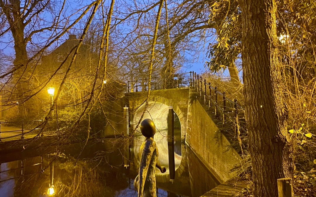 Serene evening at the canal with a bridge