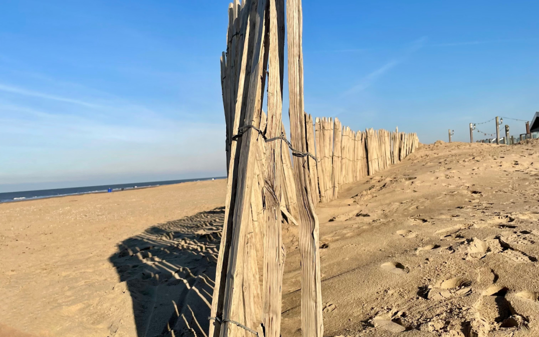 An old wooden fence on the beach.